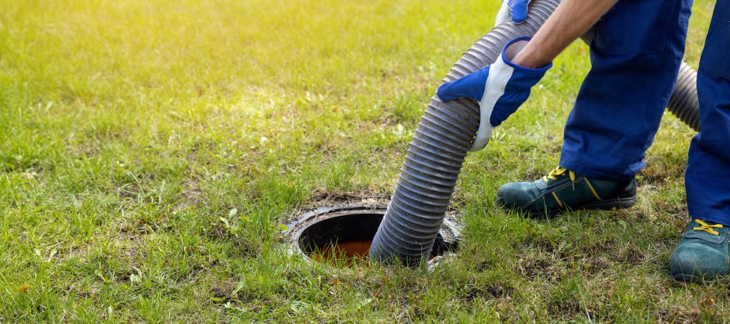 Septic tank pumping service removing waste from residential septic system
